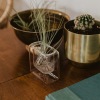 dresser with decor and plant