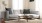 oversized windows brighten spacious, furnished living room